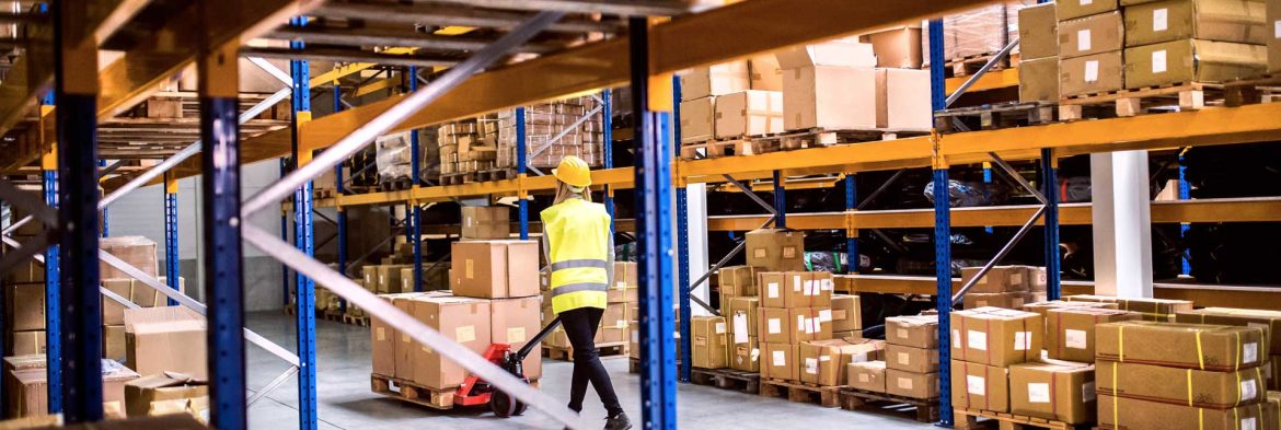 woman-warehouse-worker-with-hand-forklift-truck-PLH9ZG2.jpg